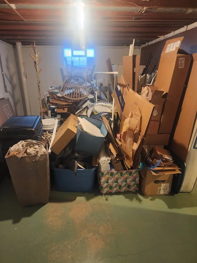 Roll-off dumpster container at job site for 2 Yard Dumpster Rental in Ely